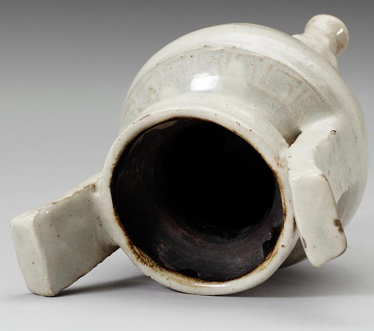 A pale grey-bluish glazed tripod censer with decor in relief, and archaistic mark, Ming dynasty (1368-1644).