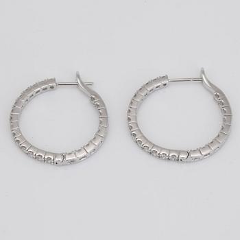 A pair of diamond, 2.303 cts according to engraving, loop earrings.