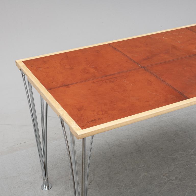 A birch and leather dining table produced by Mathsson International, 21th century.