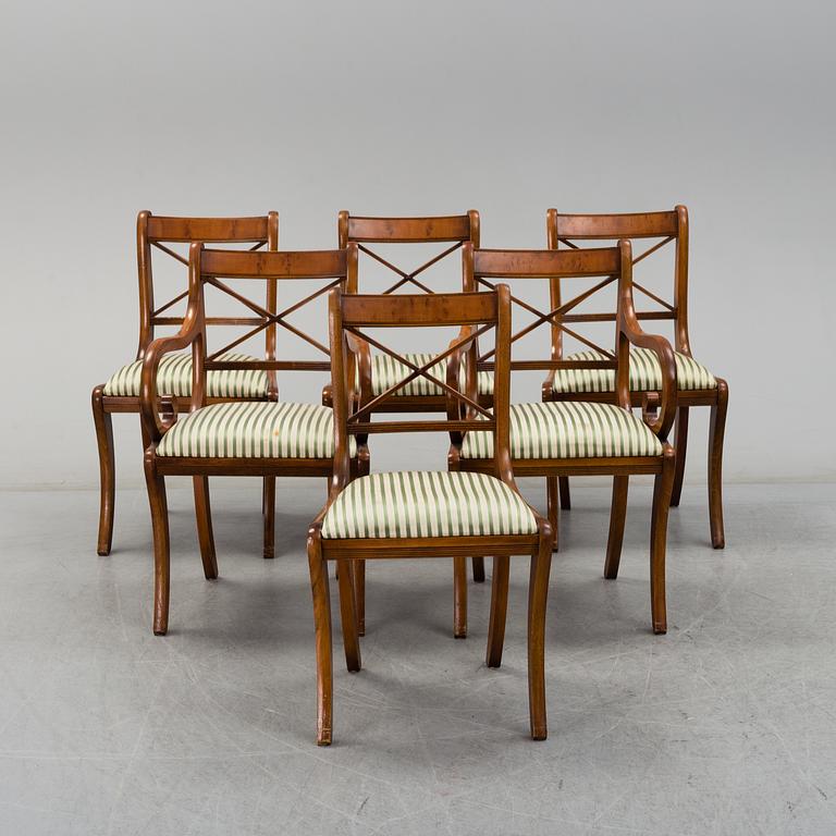 A late 20th century English style dining table and six chairs.