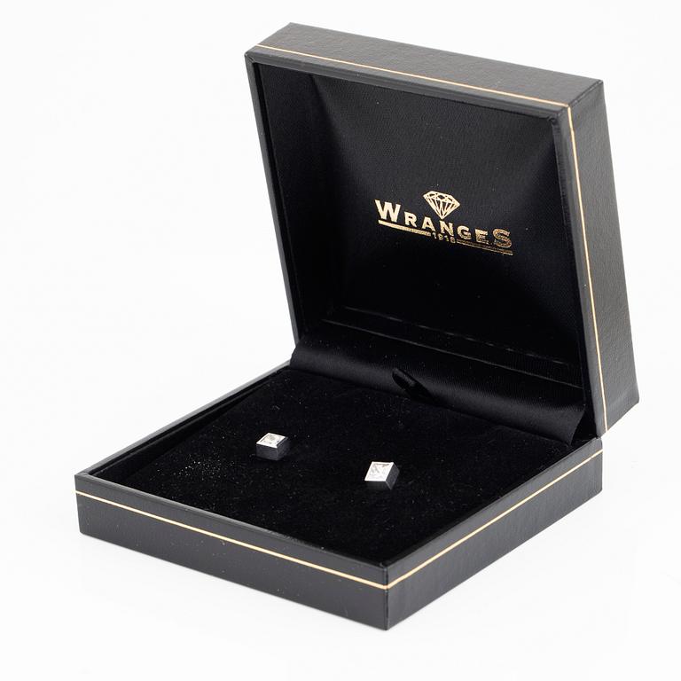 A pair of square modified brilliant cut diamond earrings.