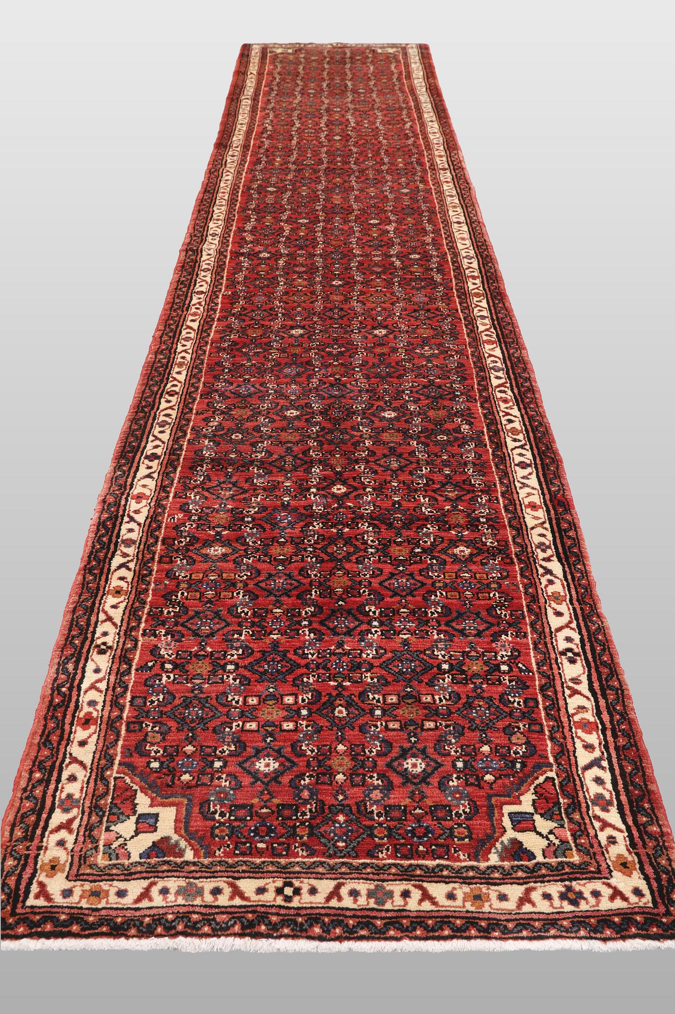 A Hosseinabad runner carpet, 500 x 93 cm.