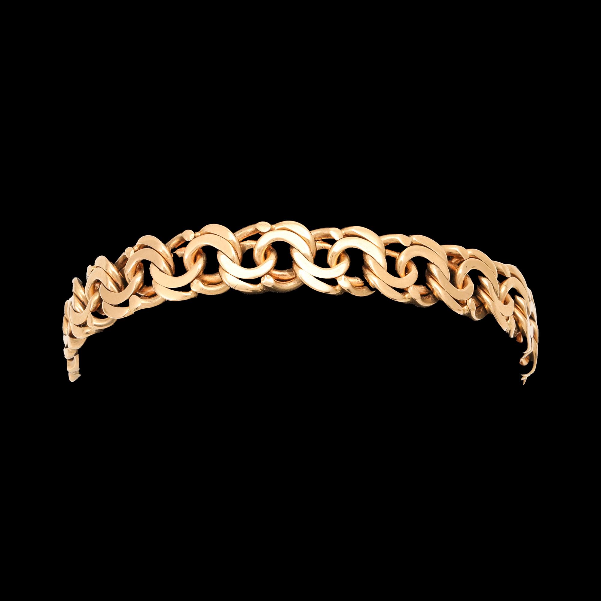 An 18K gold Bismarck bracelet.