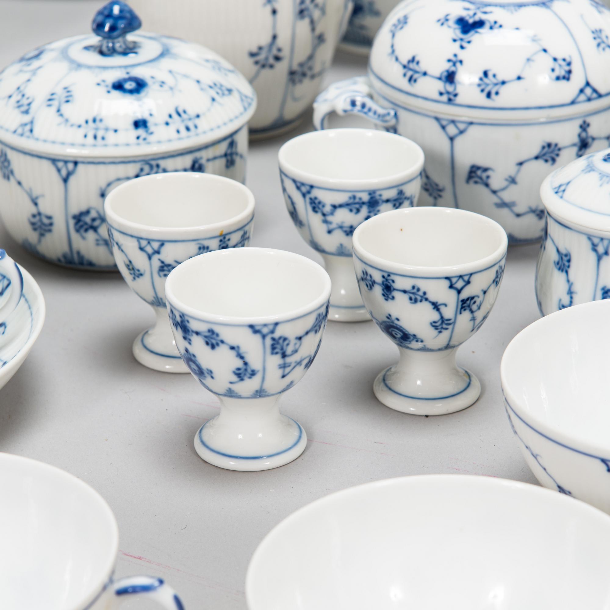 A 73-piece 'Blue Fluted Plain' porcelain tableware set, Copenhagen, Denmark, mostly 1940s-60s.