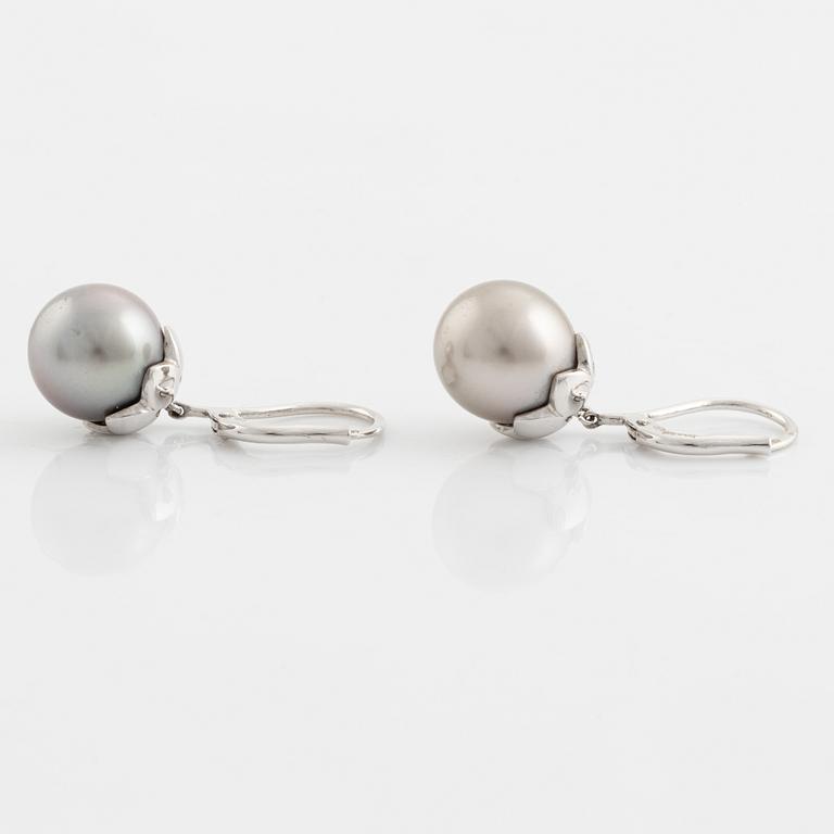 A pair of cultured pearl and brilliant cut diamond earrings.