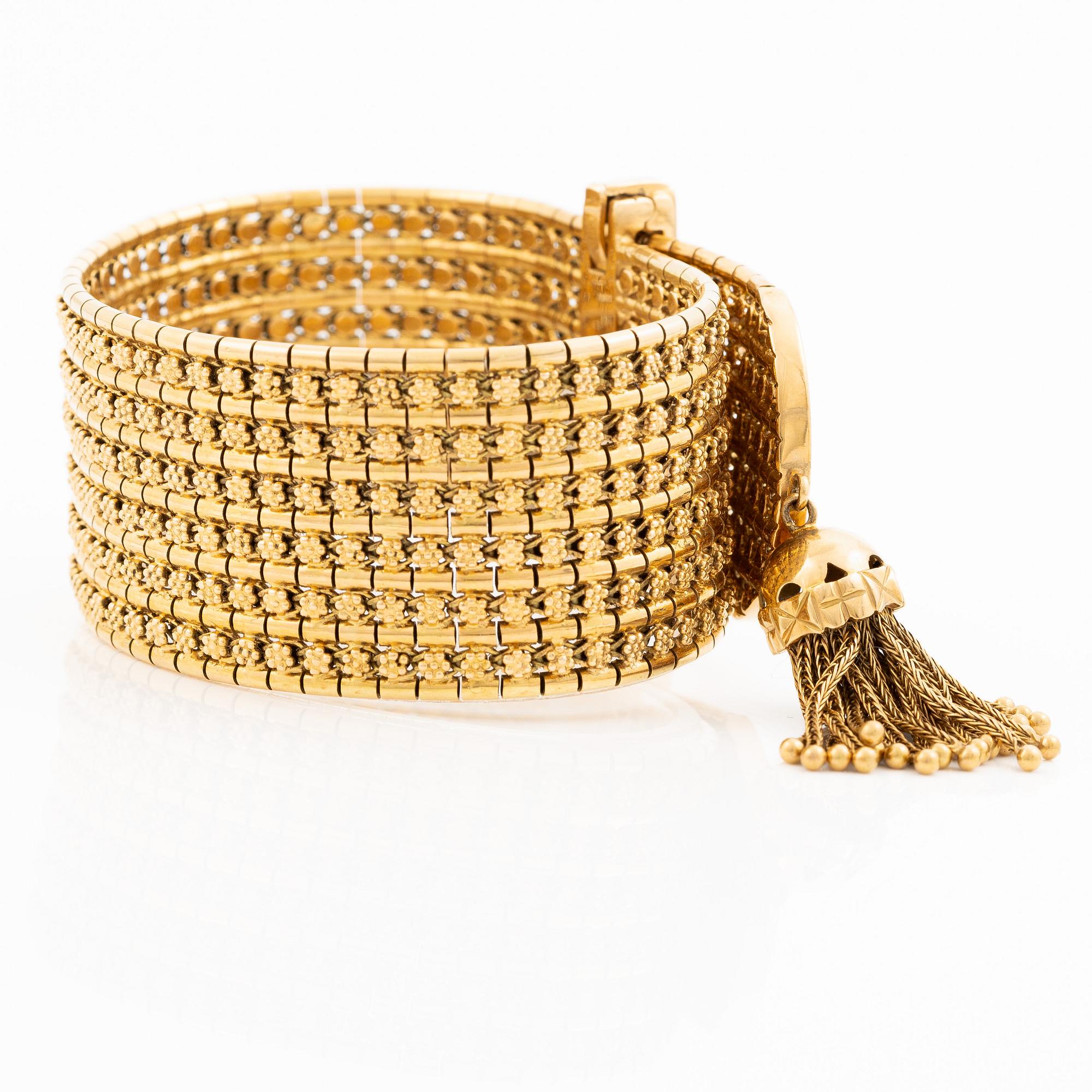 Armband 18K guld med tofs, 1900-talets andra hälft.