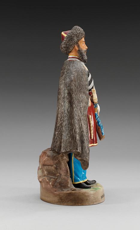 A Russian figure of Cossack frontier-guard, Gardner porcelain manufactory, ca 1900.