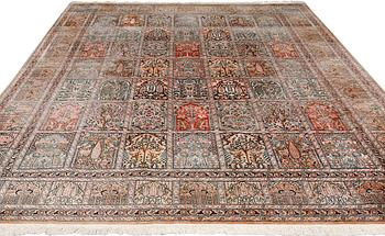 A silk Kashmir carpet, approx. 327 x 243 cm.