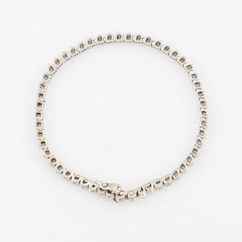 Tennis bracelet, 14K white gold and brilliant-cut diamonds.