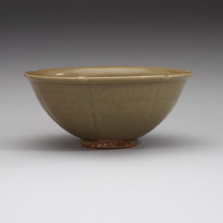 A celadon glazed bowl decorated with flowers and foliage, Ming Dynasty (1368-1644).