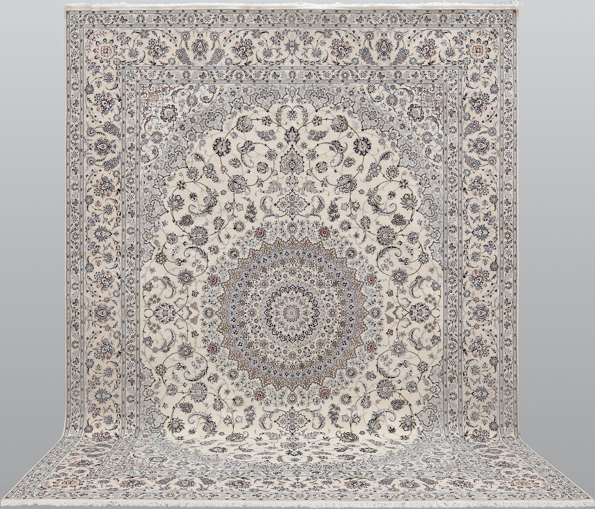 A Nain part silk carpet, 408 x 308 cm.