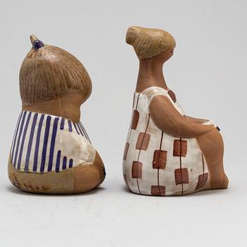 LISA LARSON, two signed stoneware figures.