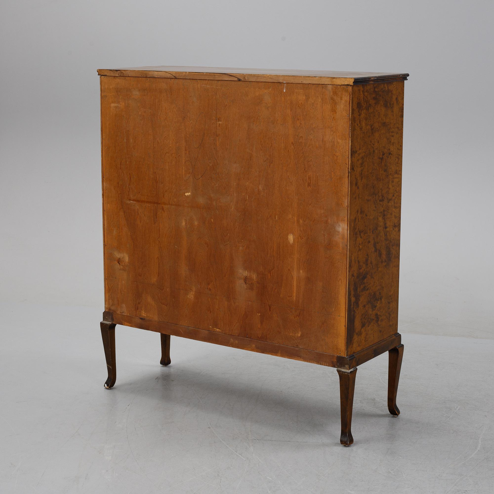 A 1920's-30's Swedish Grace birch and rosewood veneered cabinet.