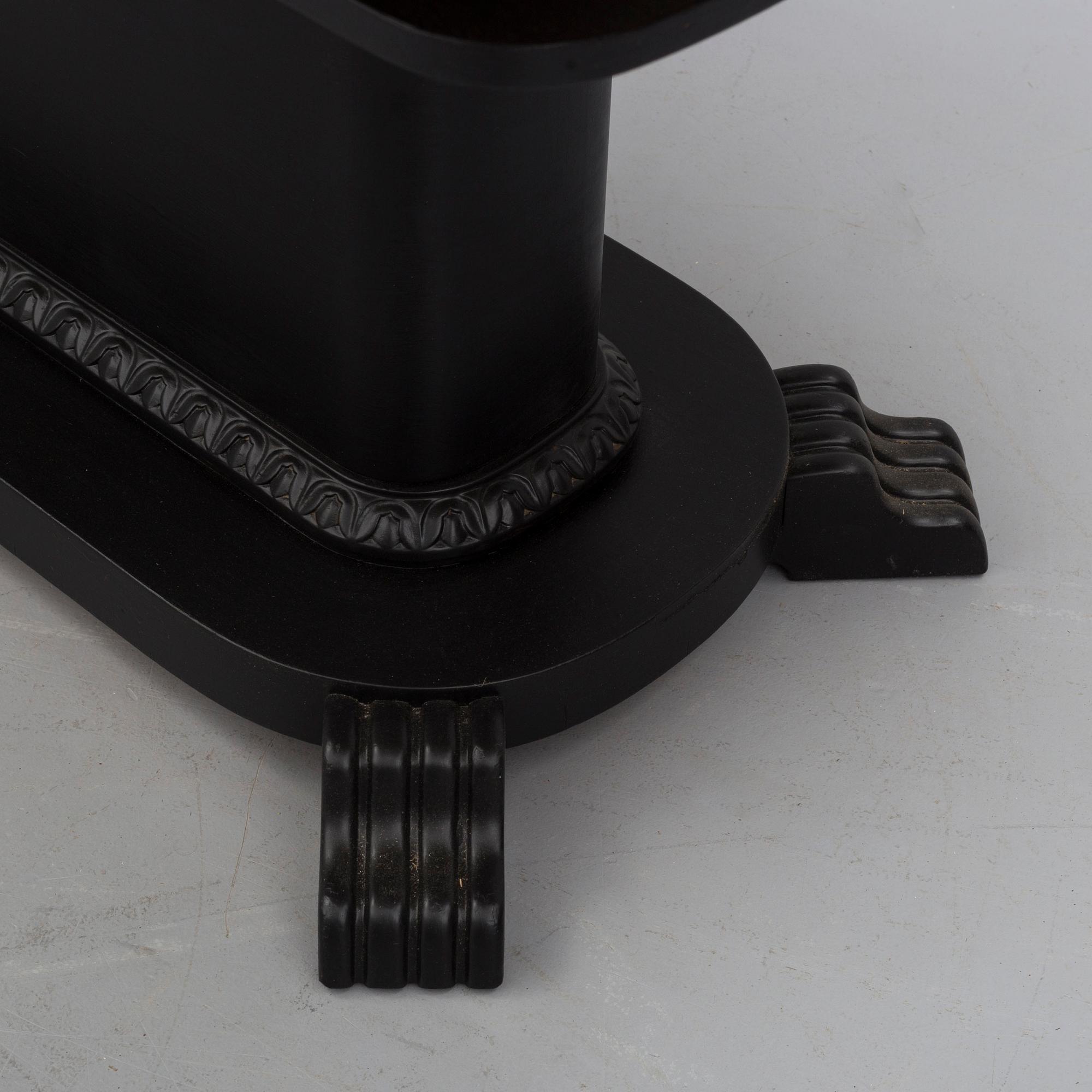 a coffee table from the first half of the 20th century.