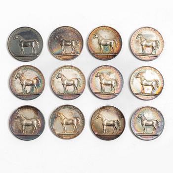 Twelve silver medals, Kungliga Myntverket, Sweden, early 20th century.
