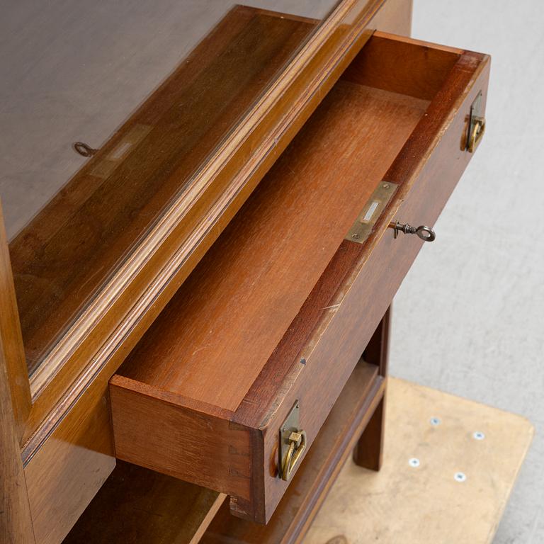 A display cabinet, early 20th Century.