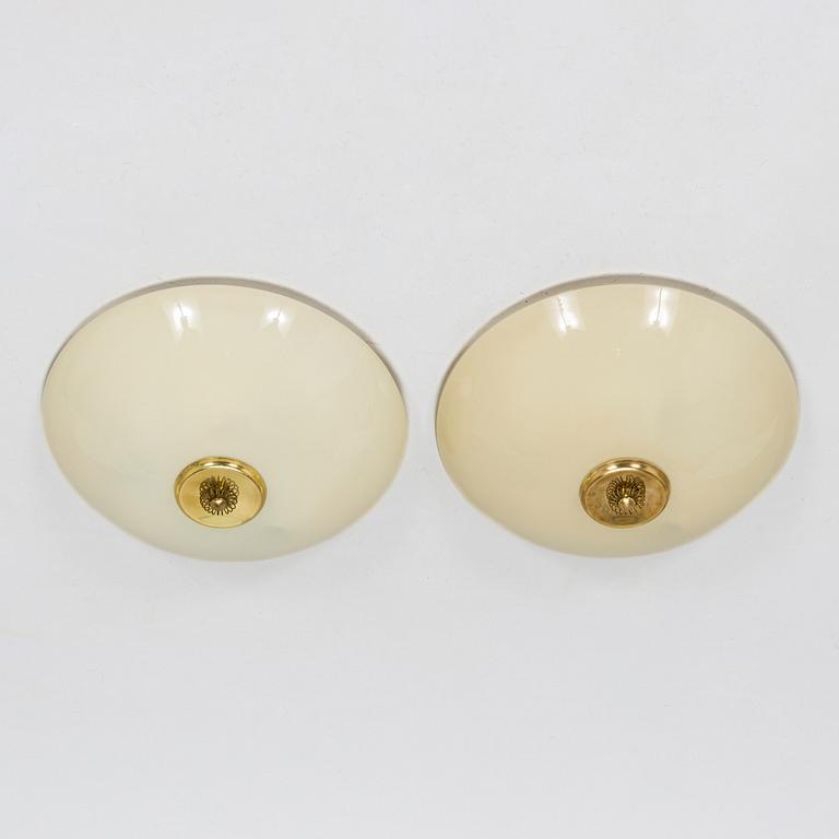 A pair of mid-20th century 'EA 72 ceiling lights for Itsu.