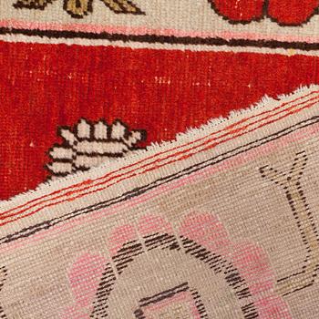 A CARPET, an antique/semi-antique Khotan figural, ca 259,5 x 160,5 cm.