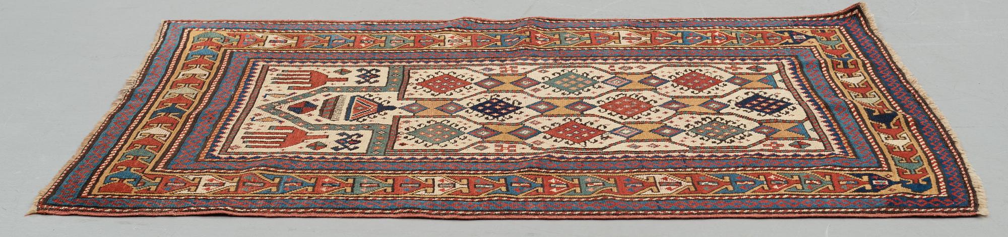 A RUG, an antique Caucasian prayer rug, Czar Russia, ca 144-151 x 103-106 cm.