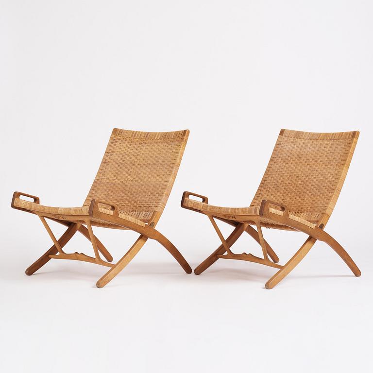 Hans J. Wegner, a pair of oak and rattan folding chairs 'JH-512', Johannes Hansen, Denmark 1950-60s.