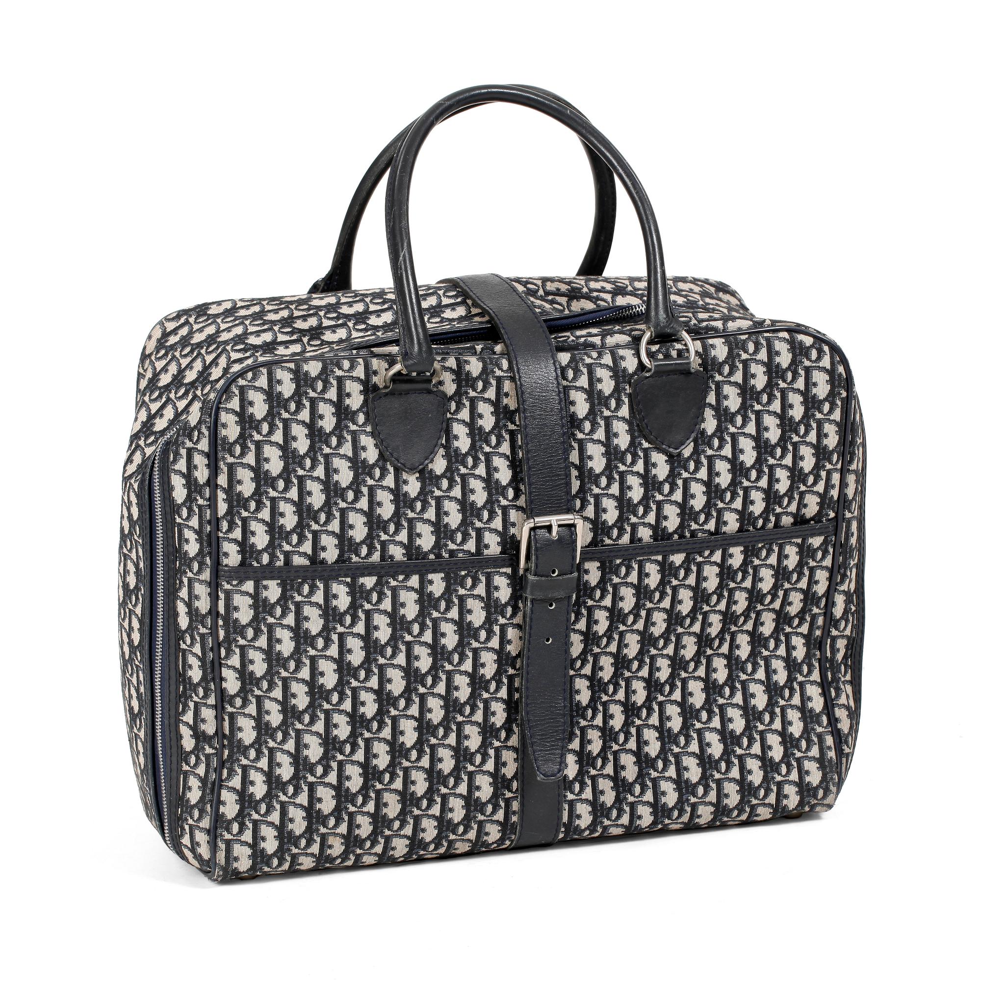 CHRISTIAN DIOR, a monogram canvas weekend bag.
