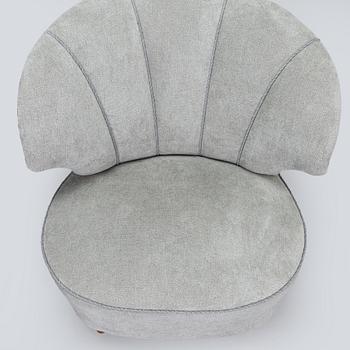 A pair of mid 20th century armchairs.