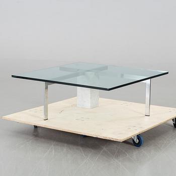 A GLASS TOP COFFEE TABLE, CA 2000.