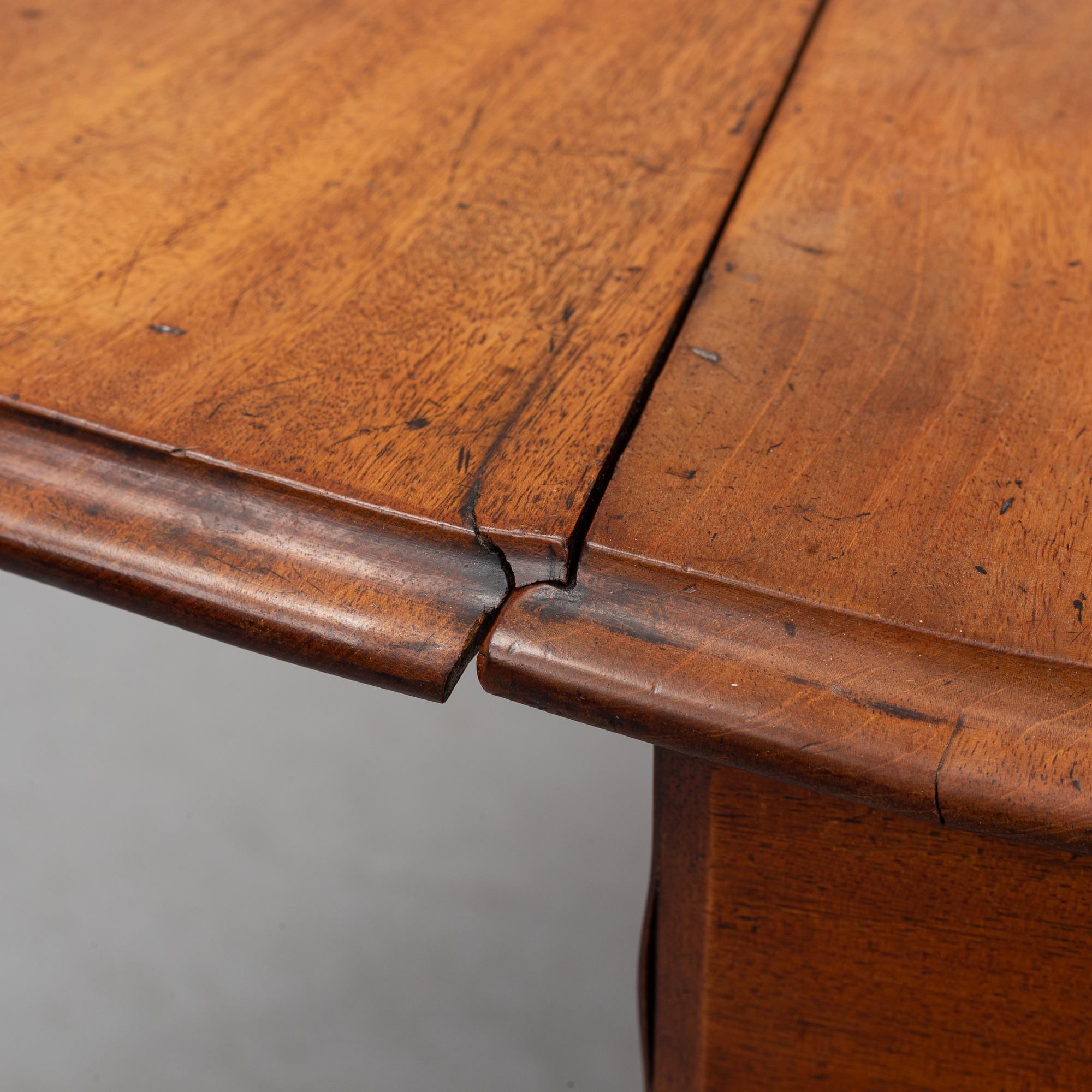 A neo-renaissance mahogany drop-leaf table from secord half of 19th century.