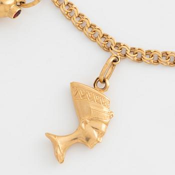 Armband med berlocker 18K guld.