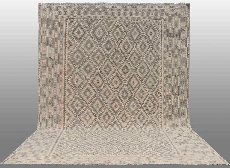An oriental kilim 515 x 350 cm.
