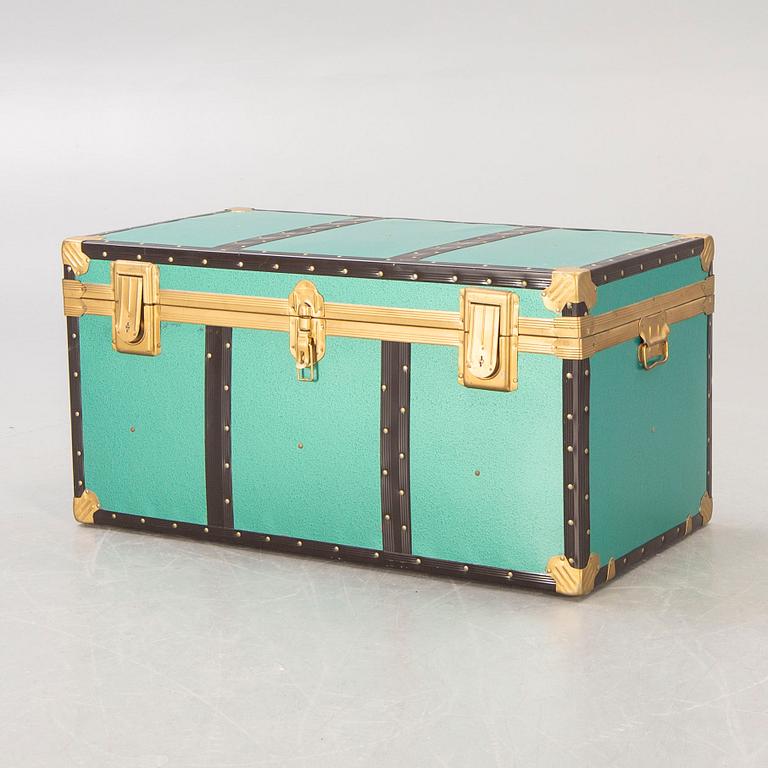 A mid 1900s metal trunk.