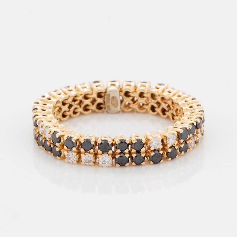 White and black brilliant-cut diamond ring.