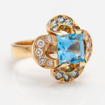 An 18K gold ring "Catherine Jagiellon" with diamonds ca 0.37 ct in total and topazes. Ofelia Jewelry, Helsinki 1998.