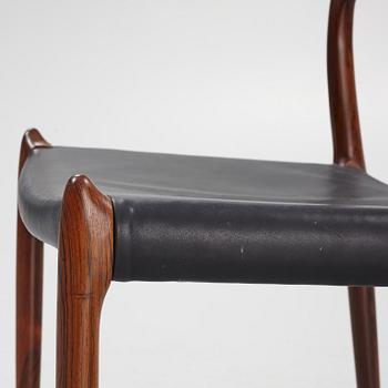 Niles Otto Møller, a rosewood veneered table with four chairs, JL Møller, Denmark, 1950's/60's.