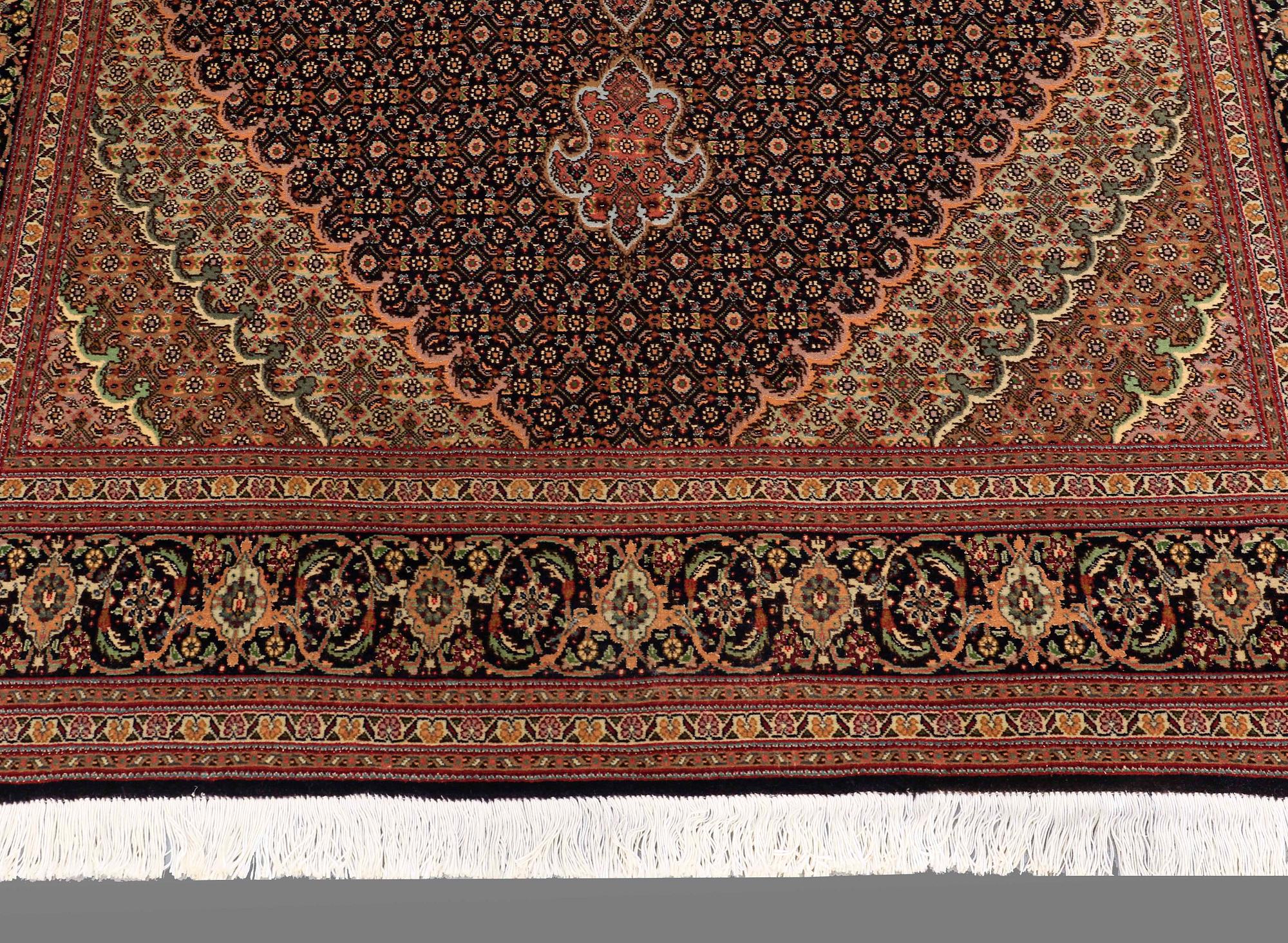 A RUG, Tabriz, part silk, so called 50 Radj, around 220 x 150 cm.