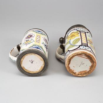 Two pewter mounted faience tankards, Germany, 18th century..