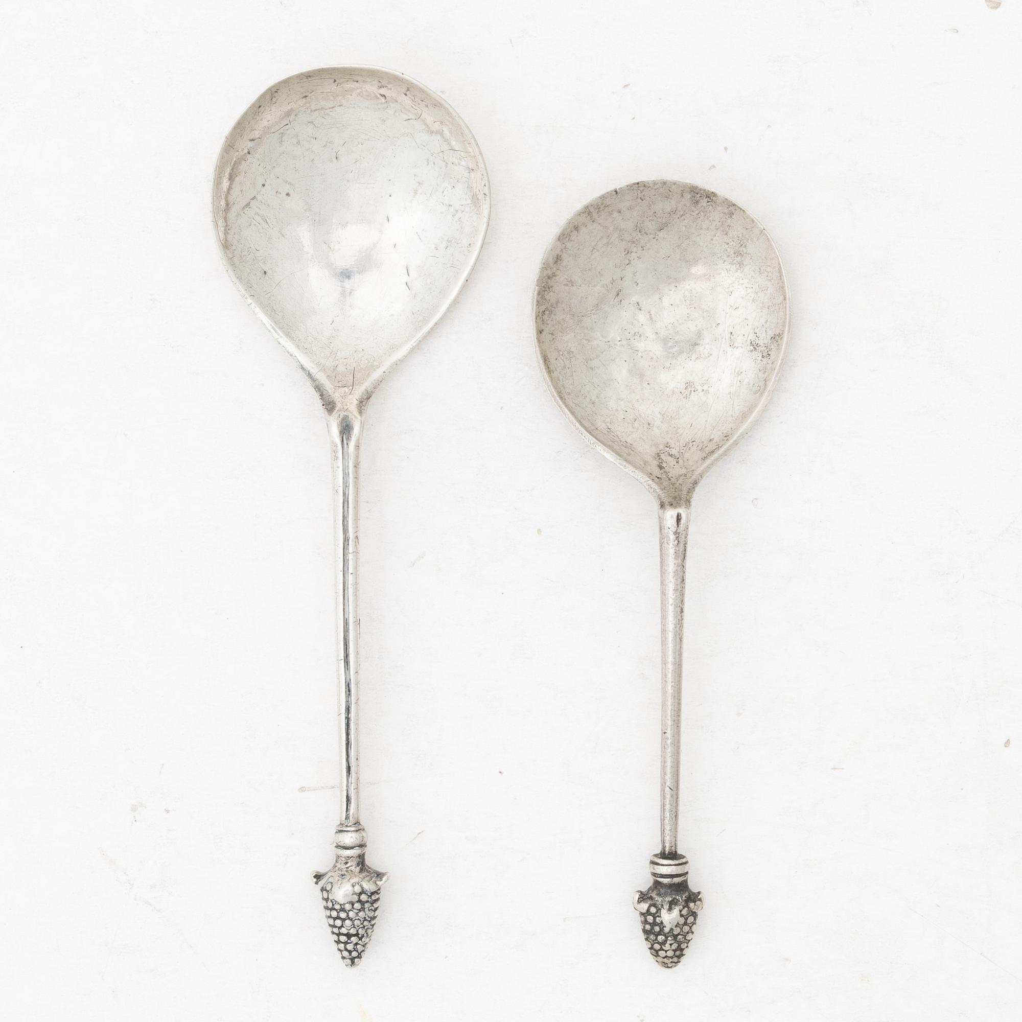 Two unmarked silver spoons, likely 18th century.