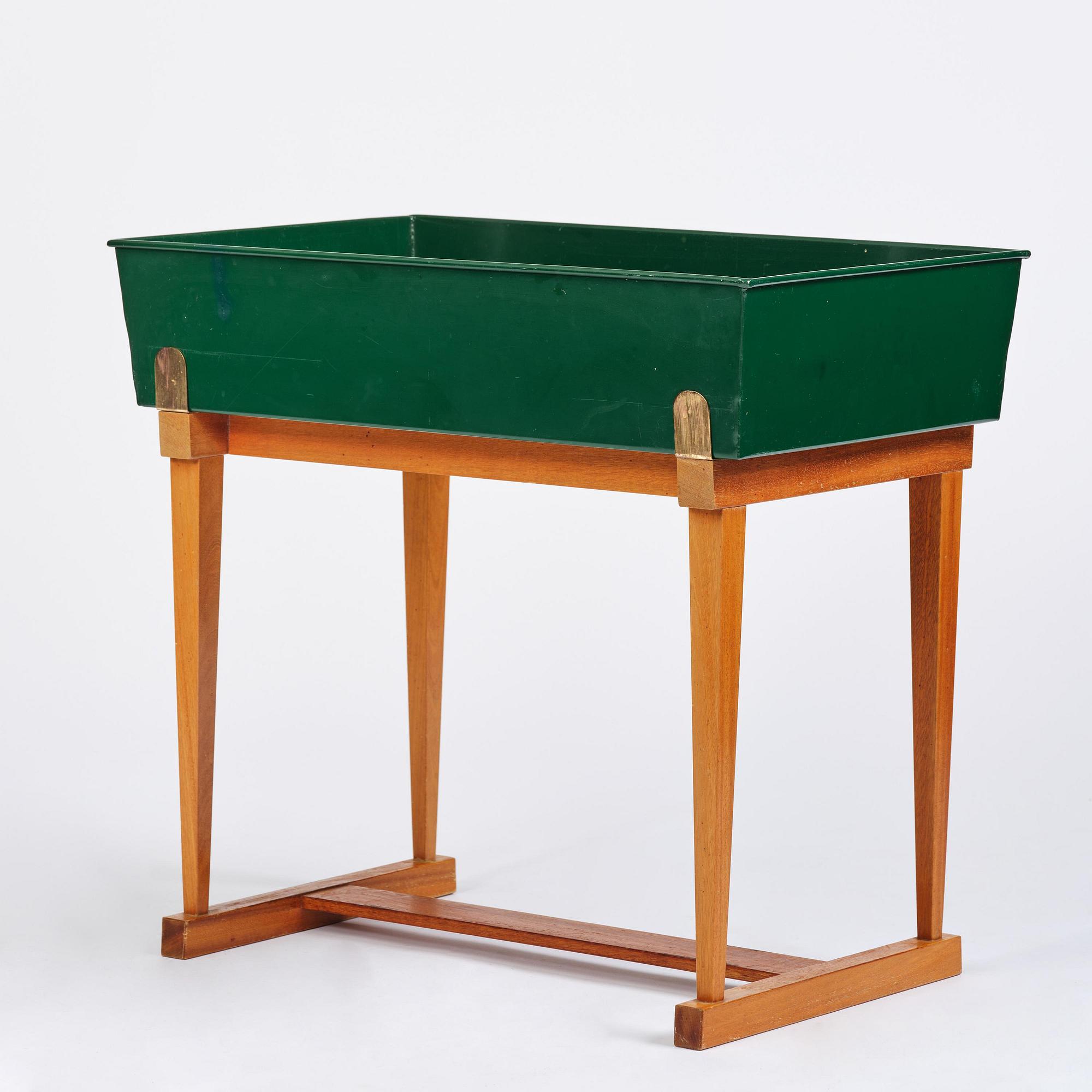 Josef Frank, a rare flower table with green lacquered box model B 2084, Firma Svenskt Tenn, 1950-60s.