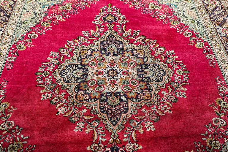 A Tabriz carpet, c. 330 x 250 cm.