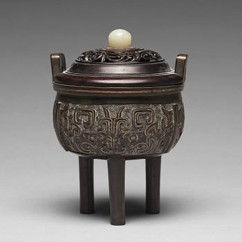 A tripod bronze censer Qing dynasty, 19th Century.