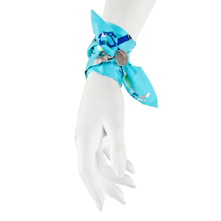 HERMÈS, two silk braclets with palladiumcovered locks.