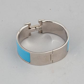 HERMÈS, a 'Clic H' bangle.