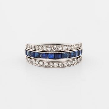 A square cut sapphire and single cut diamond ring.