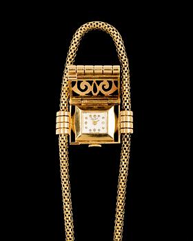 A Solvil ladie´s wrist watch 18k gold and brilliant cut dimonds.