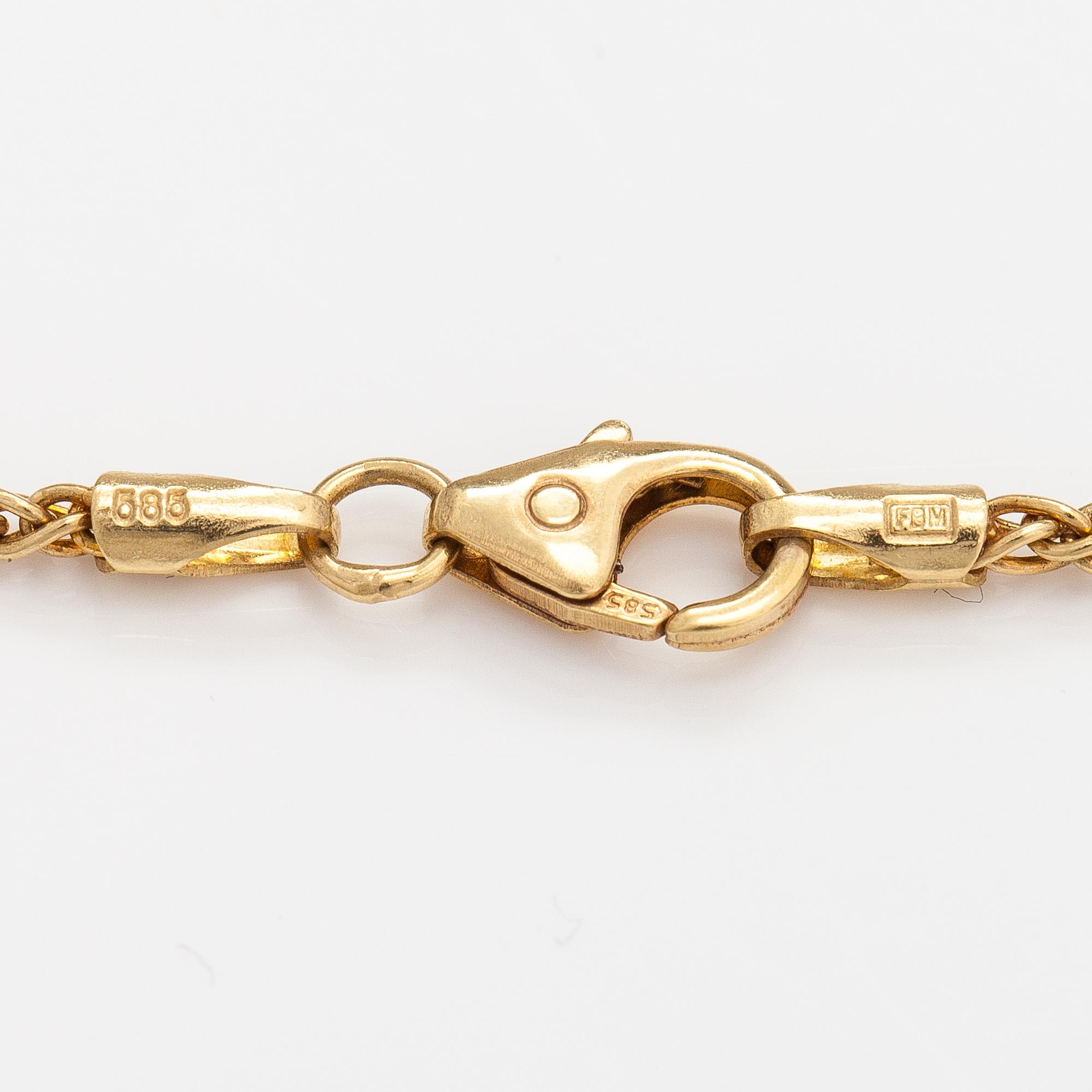 A 14K and 18K gold necklace with a tahiti pearl and diamonds ca. 0.72 ct in total. Ofelia jewelry, Helsinki.