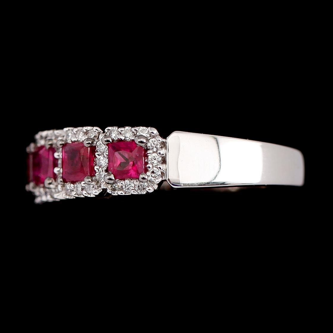 RING, 18 k vitguld, rubiner tot 0.87 ct, diamanter tot 0.24 ct.