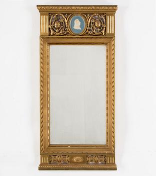 A MIRROR, gustavian style, first half of the 20th century.