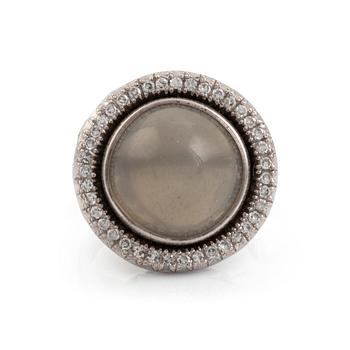 540. A cabochon cut grey moonstone and diamond ring.