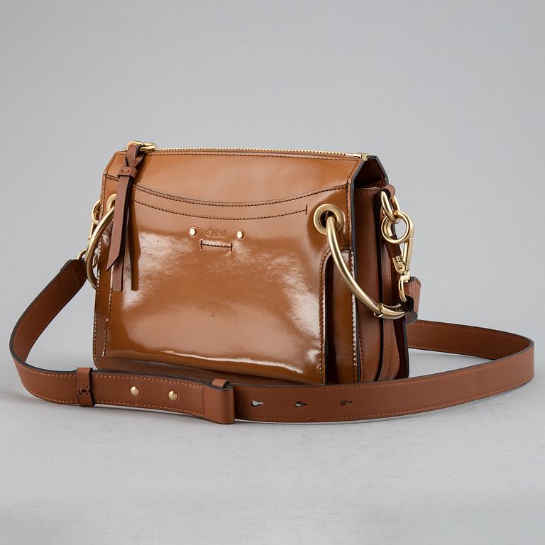 CHLOÉ, a small caramel 'Roy bag'.