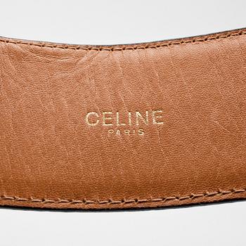 CÉLINE, a green crocodile belt.